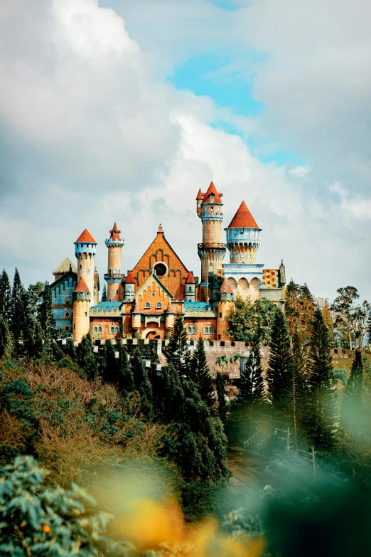 a castle sitting on top of a lush green hillside, inspired by disney, pexels contest winner, art nouveau, indonesia, winter, colorful warcraft architecture, exterior botanical garden