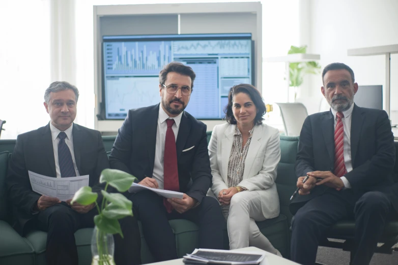 a group of people sitting next to each other in a room, professional image, traders, ignacio fernández ríos, thumbnail