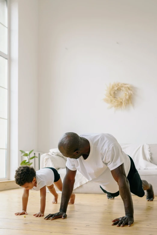 a man and a child doing push ups in a living room, pexels contest winner, plain background, brown, people walking around, profile image