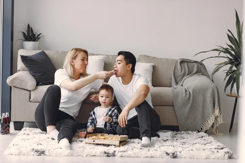 a family sitting on the floor eating pizza, a cartoon, by Adam Marczyński, pexels contest winner, couch, attractive man, husband wife and son, profile image