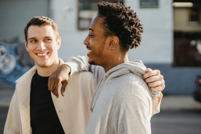 a couple of men standing next to each other, trending on pexels, happy friend, edmund blair and charlie bowater, diverse, ad image