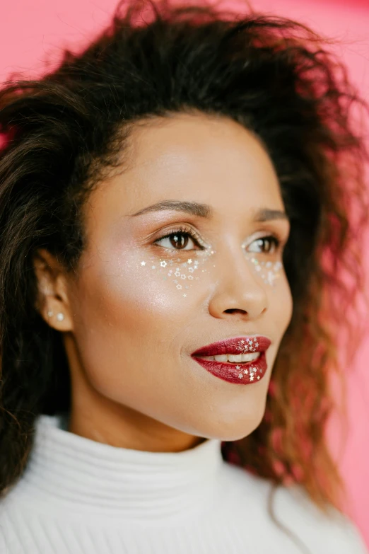 a woman with a lot of glitter on her face, inspired by Cosmo Alexander, trending on pexels, mixed race woman, glossy white, maroon metallic accents, holiday vibe
