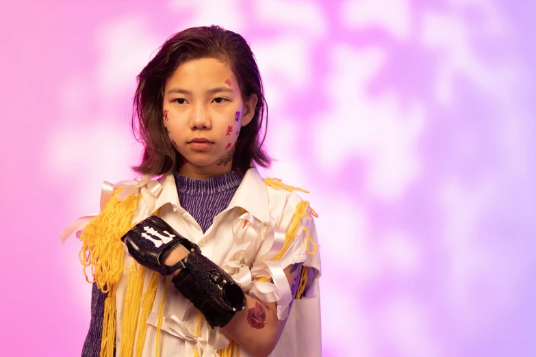 a young girl dressed in a costume holding a camera, inspired by Hikari Shimoda, unsplash, graffiti, bandage taped fists, wax figure, brutalist fashion show, asian human