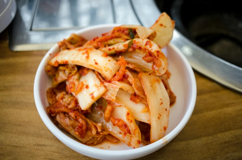 a close up of a bowl of food on a table, inspired by Choi Buk, pexels contest winner, ash ketchup, square, sangyeob park, 2995599206