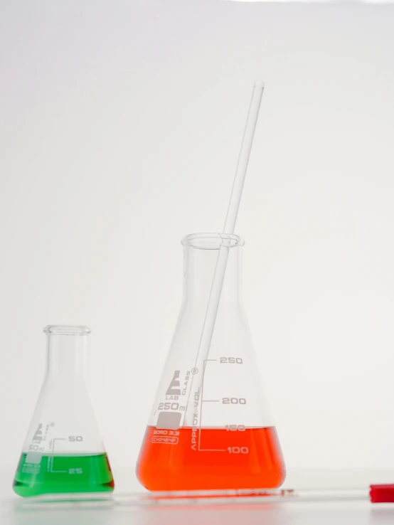 a group of laboratory flasks sitting on top of a table, an album cover, unsplash, single long stick, profile close-up view, highly detailed product photo, background image