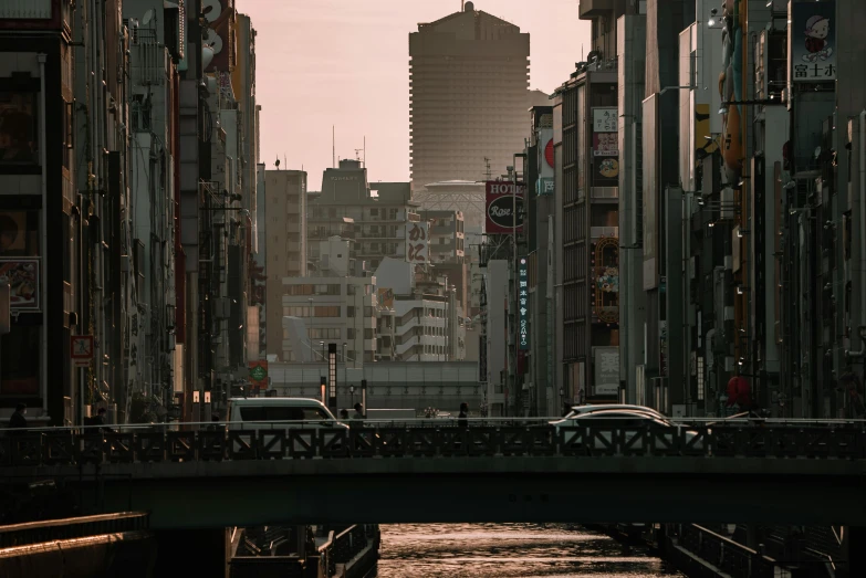 a river running through a city next to tall buildings, a picture, pexels contest winner, ukiyo-e, cinematic morning light, brutalist city architecture, japanese neon signs, instagram picture