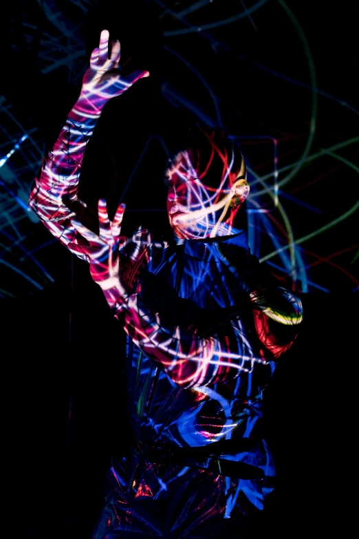 a man standing in the dark holding a tennis racquet, a hologram, by Gwen Barnard, pexels, interactive art, bodypainting, abstract human figures dancing, red and blue black light, rave girl
