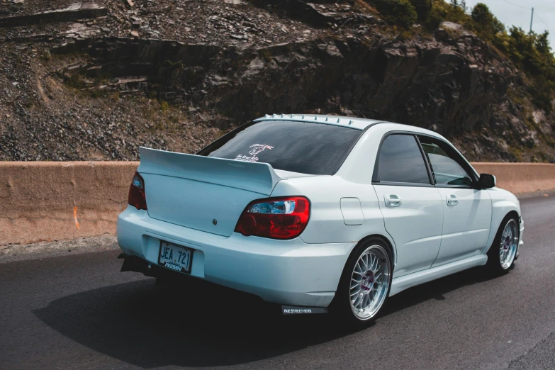 a car that is sitting on the side of the road, a picture, by Drew Tucker, unsplash, wrx golf, '0 0 s nostalgia, full body profile, white pearlescent
