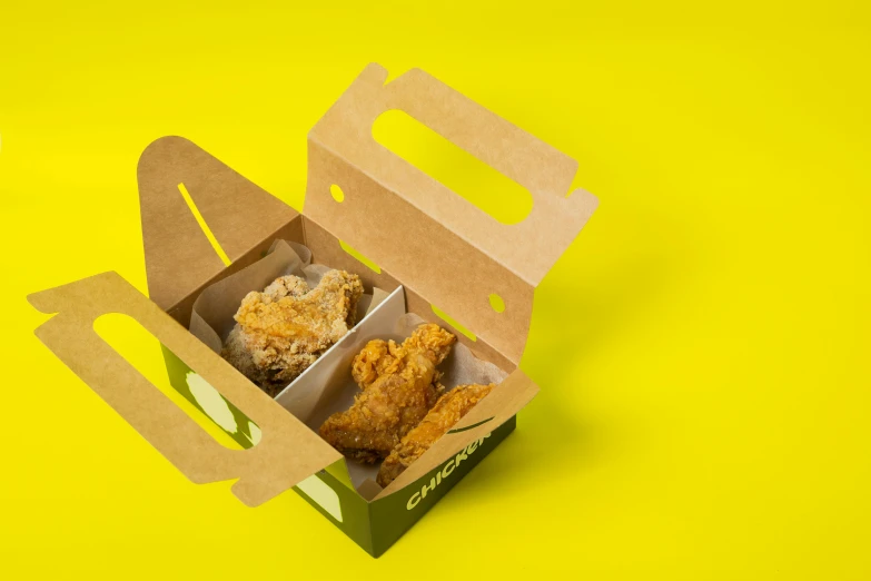 a box of fried chicken on a yellow background, by Eden Box, pexels, three fourths view, green, on grey background, drive out