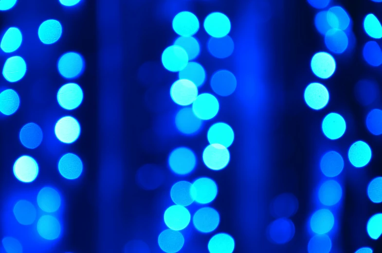 blue christmas lights in a dark room, inspired by Yves Klein, pexels, generative art, light blue background, bokeh. brian spilner, zoomed in shots, my rendition