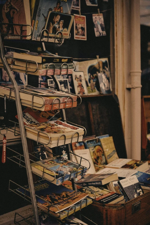 a pile of books sitting on top of a table, sitting on a store shelf, indie film, magazines, vintage disney