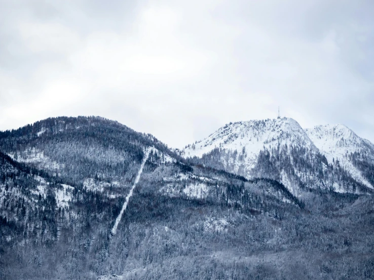 a group of people riding skis down a snow covered slope, by Muggur, pexels contest winner, les nabis, ominous! landscape of north bend, seen from a distance, icicle, in karuizawa