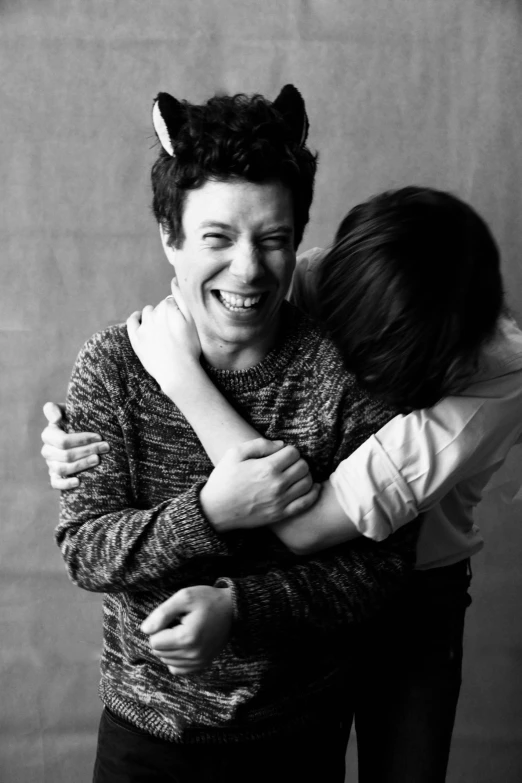 a couple of people that are hugging each other, by Felix-Kelly, aiden gillen, monochrome:-2, finn wolfhard, with a happy expression