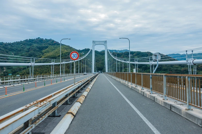 a bridge with a sign on the side of it, unsplash, sōsaku hanga, 🚿🗝📝, completely empty, thumbnail, maintenance photo