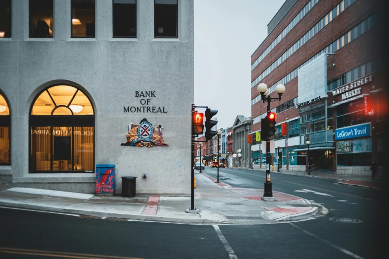 a street corner with a bank of montreal sign, pexels contest winner, building facing, overview, front lit, set inside of the bank