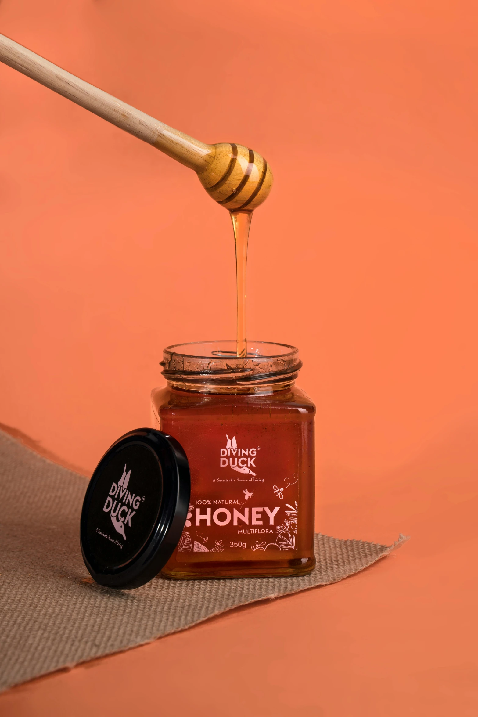 a jar of honey sitting on top of a table, detailed product image, award - winning design, burnt, vibrant