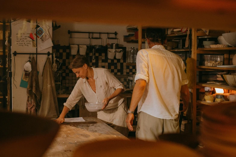 a couple of men standing next to each other in a kitchen, pexels contest winner, process art, terracotta, people at work, white clay, profile image