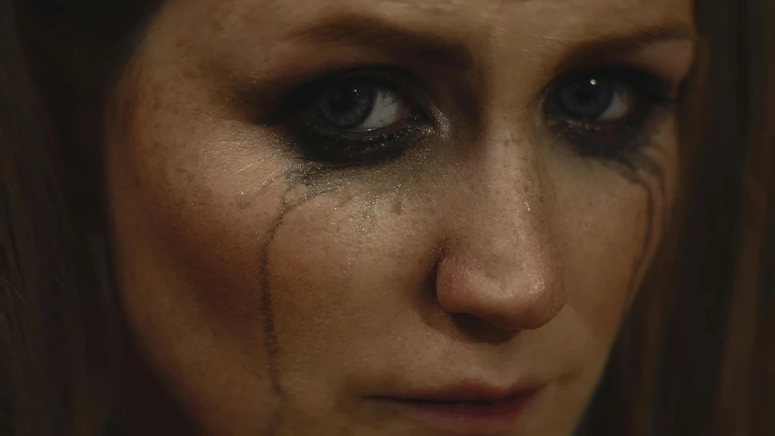 a close up of a woman with tears on her face, an album cover, inspired by Nan Goldin, pexels, renaissance, 2 0 2 1 cinematic 4 k framegrab, sansa, still from a music video, with black eyes