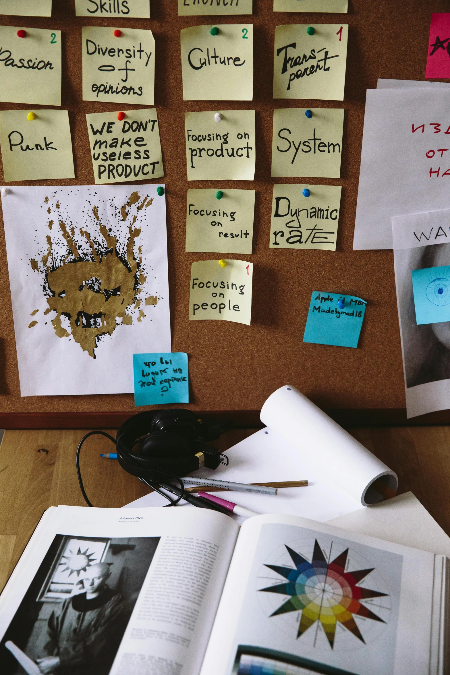 an open book sitting on top of a wooden desk, a picture, inspired by Rube Goldberg, process art, with labels and notes, poop, ux, scrap metal on workbenches