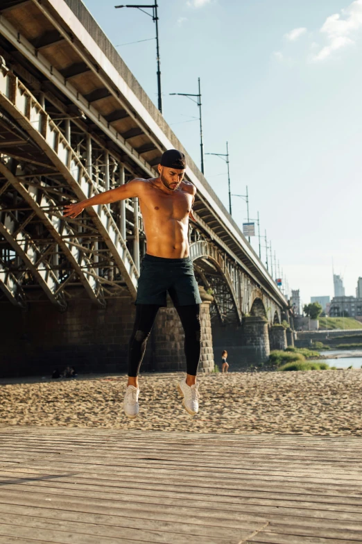 a man flying through the air while riding a skateboard, pexels contest winner, figuration libre, wearing a tank top and shorts, standing on a bridge, muscular! crossfit, neo kyiv
