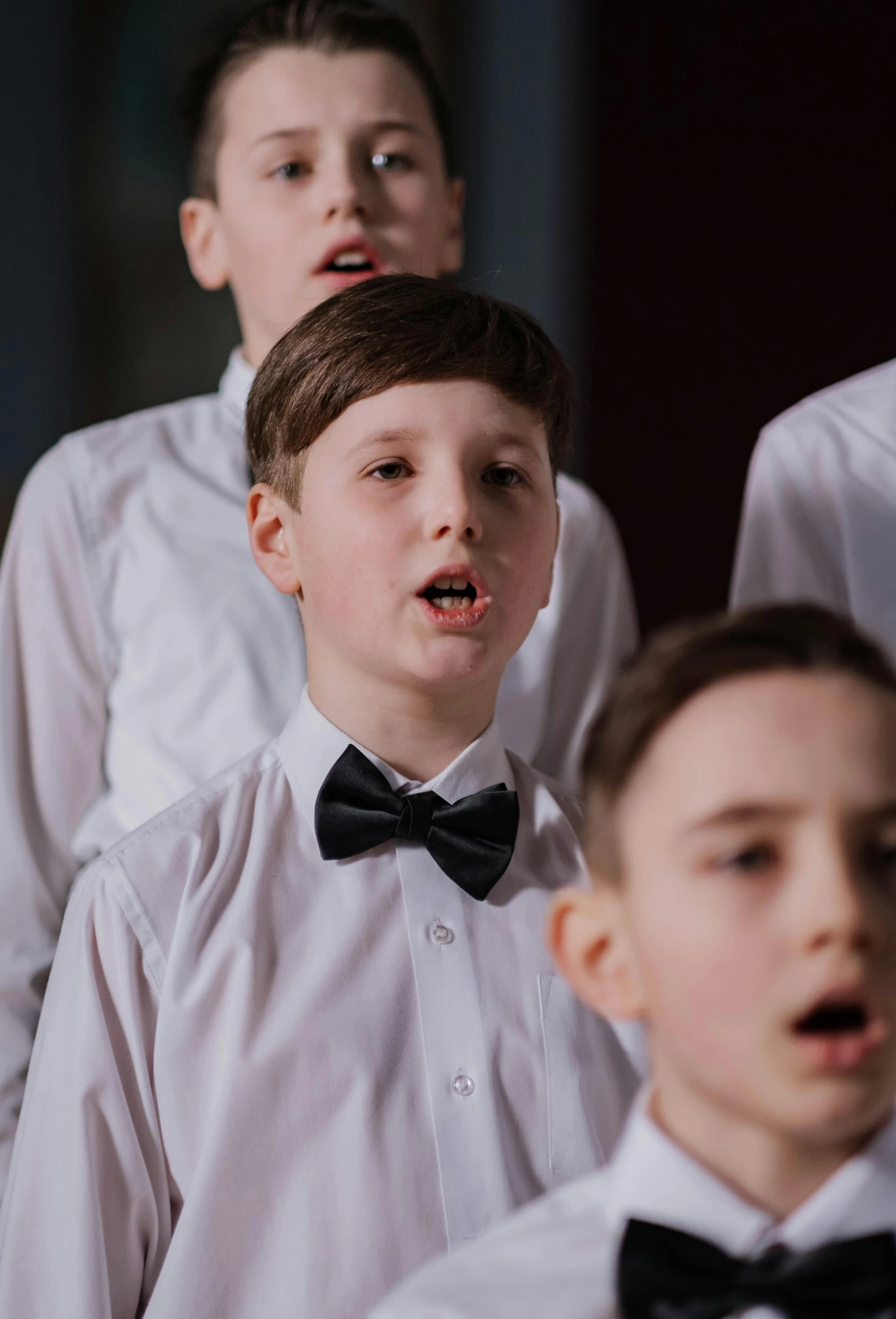 a group of young men standing next to each other, an album cover, by Ruth Simpson, pexels contest winner, choir, boy with neutral face, performance, closeup - view