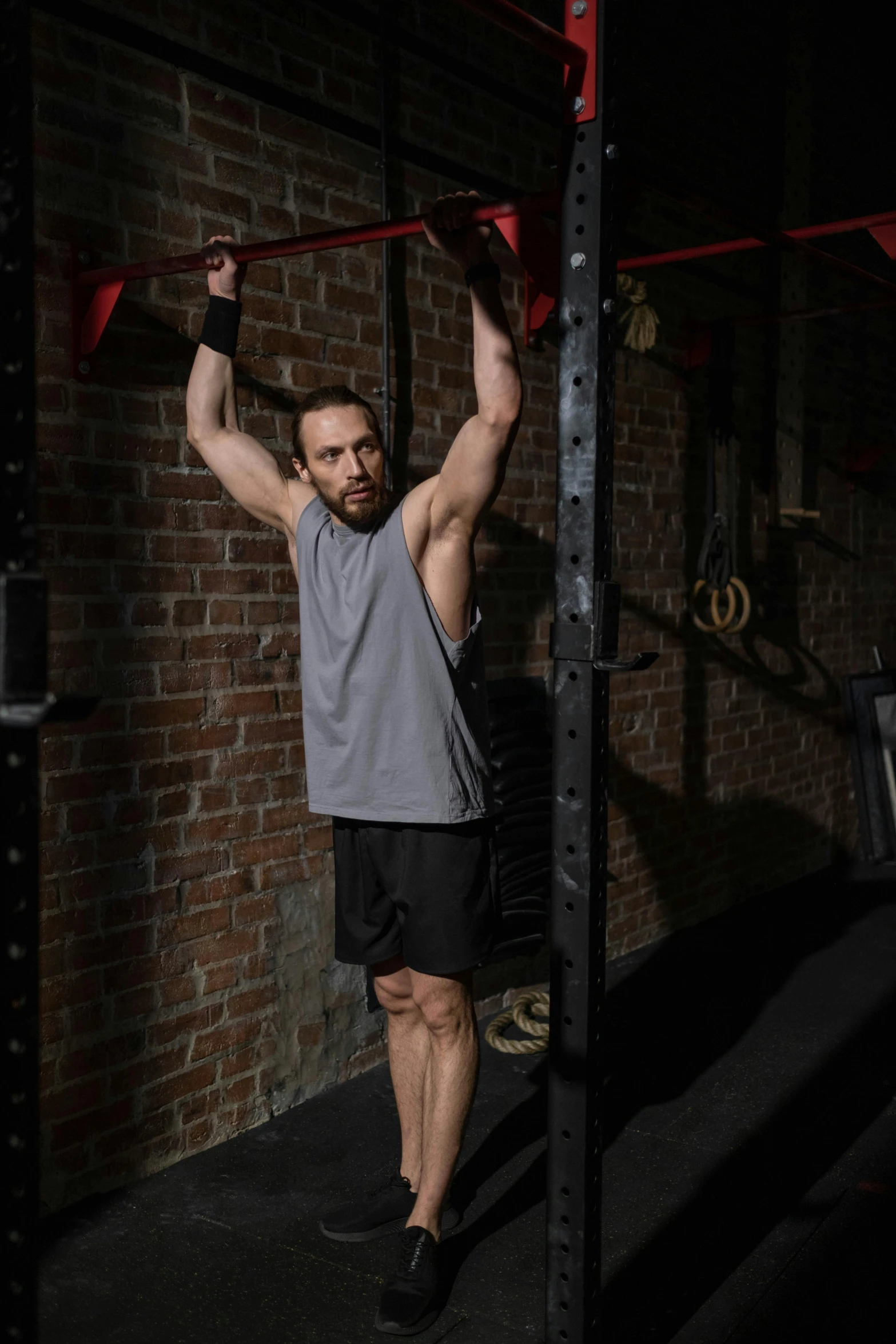 a man doing pull ups in a gym, a portrait, pexels contest winner, renaissance, square, charlie cox, full body picture, gif