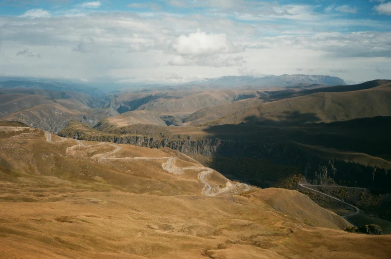 a view of the mountains from the top of a hill, by Muggur, pexels contest winner, les nabis, georgic, aerial view, slightly tanned, marsden