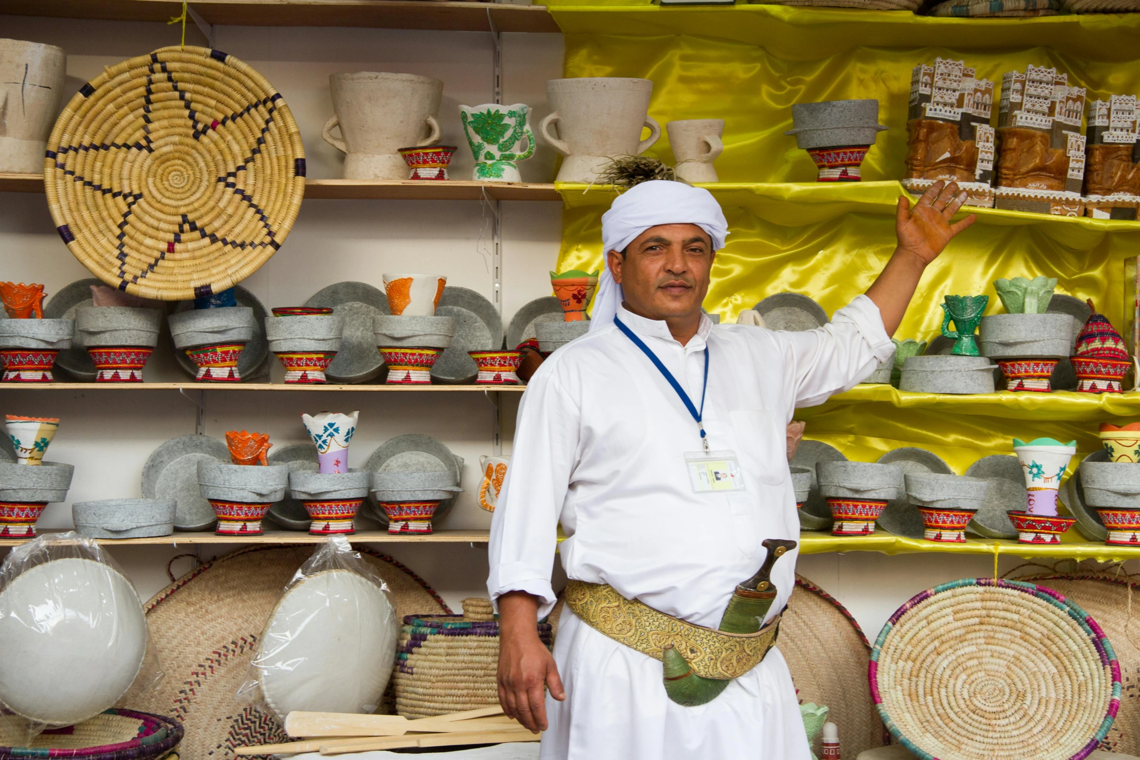 a man that is standing in front of a shelf, egyptian art, pexels contest winner, presenting wares, pith helmet, white and yellow scheme, on location