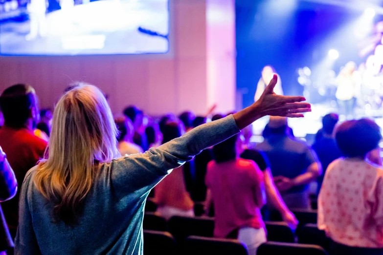 a woman standing in front of a crowd of people, worship, in church, image of random arts, fan favorite