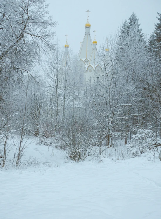 a church in the middle of a snowy forest, inspired by Andrei Rublev, pexels contest winner, romanticism, silver，ivory, low quality photo, helsinki, today\'s featured photograph 4k