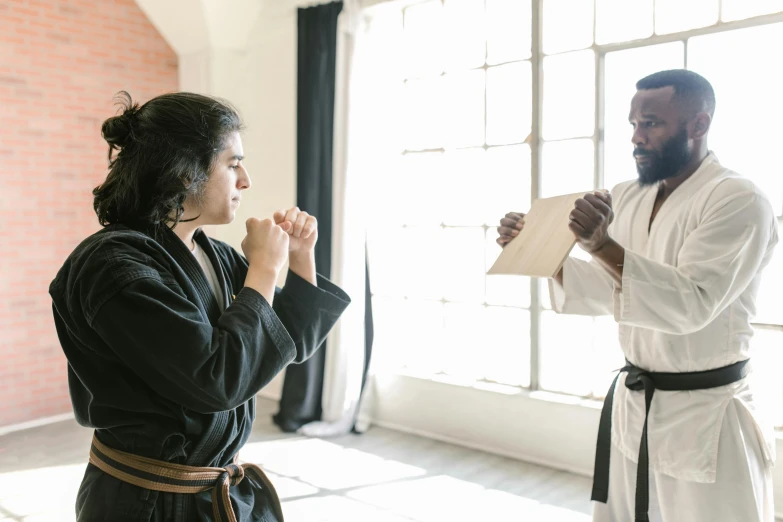 a man standing next to a woman in a room, doing martial arts, profile image, wearing brown robes, multiple stories