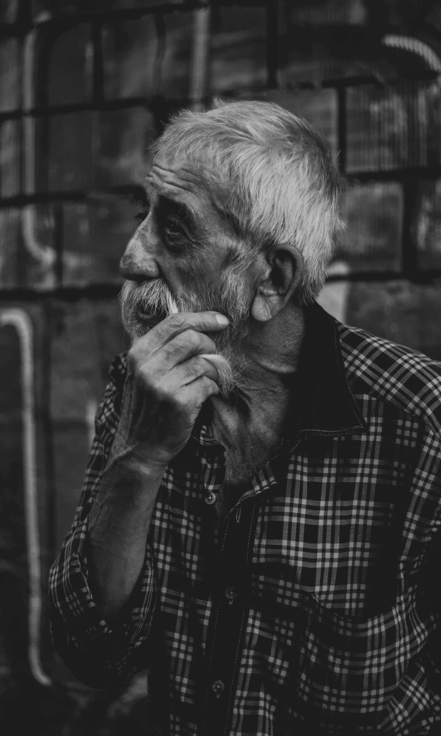 a black and white photo of a man smoking a cigarette, pexels contest winner, looking old, 15081959 21121991 01012000 4k, a photo of a disheveled man, thoughtful )