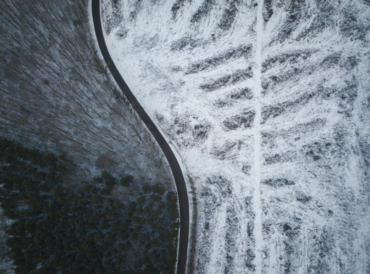 an aerial view of a snow covered road, an album cover, pexels contest winner, land art, curves, “ iron bark, hunting, frost
