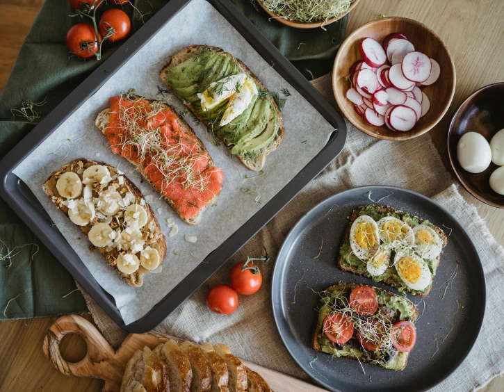 a wooden table topped with plates of food, battle toast, flat lay, nordic, instagram photo