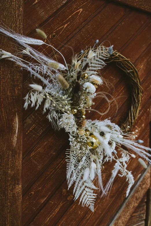 a close up of a wreath on a wooden door, by Jessie Algie, baroque, dry grass, iridescent and gold and crystal, detailed white, medium