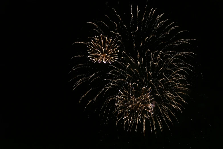 a fireworks is lit up in the night sky, pexels, hurufiyya, fan favorite, dark. no text, low quality photo, high resolution image