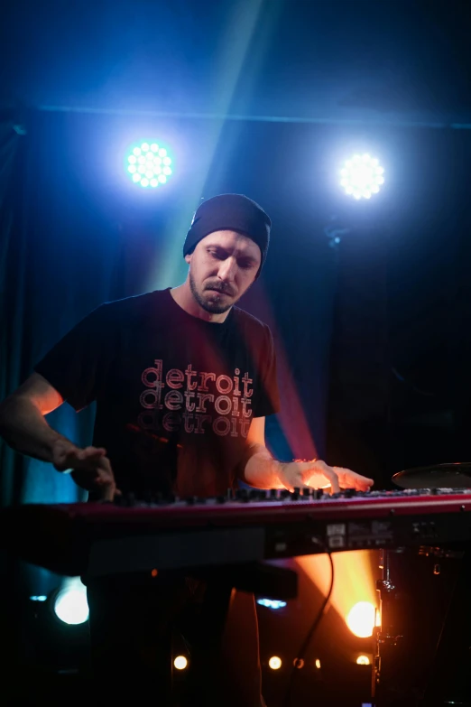 a man that is standing in front of a keyboard, a portrait, featured on reddit, purism, boards of canada, performing on stage, michigan, avatar image