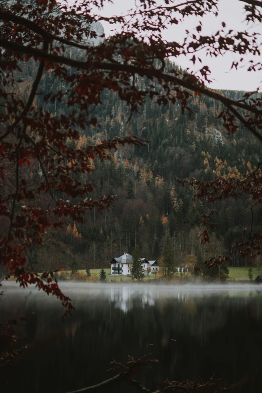 a large body of water surrounded by trees, a picture, by Sebastian Spreng, pexels contest winner, renaissance, lake house, autumn rain turkel, winter setting, in the mountains