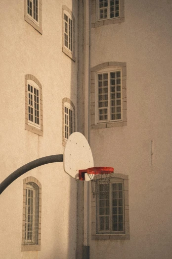 a basketball hoop in front of a building, inspired by André Kertész, pexels contest winner, hoog detail, castle in the middle, nazare (portugal), charles sheeler