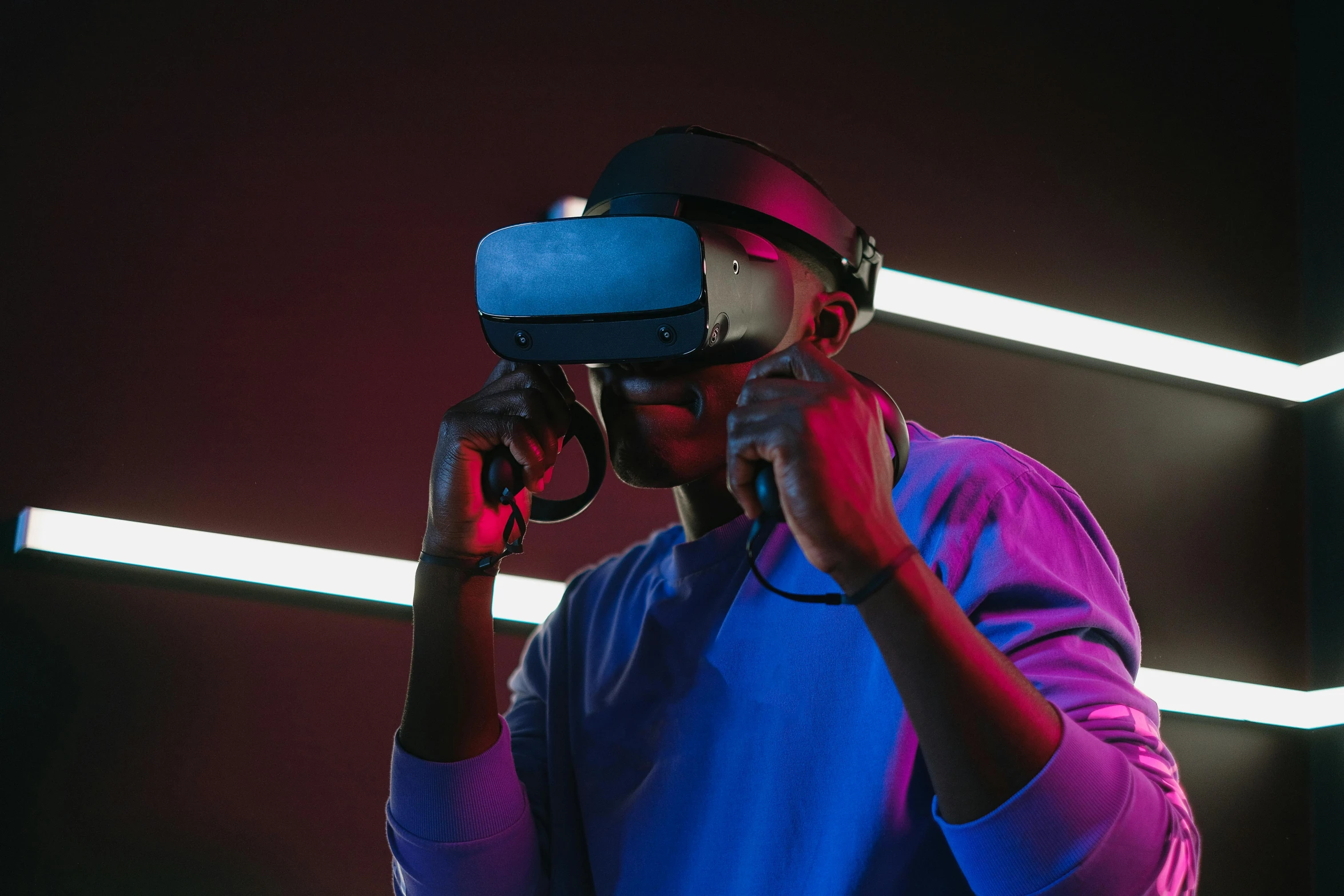 a man using a virtual reality headset in a dark room, hypermodernism, neon blue glass forehead, ((raytracing)), afro tech, oculus quest 2