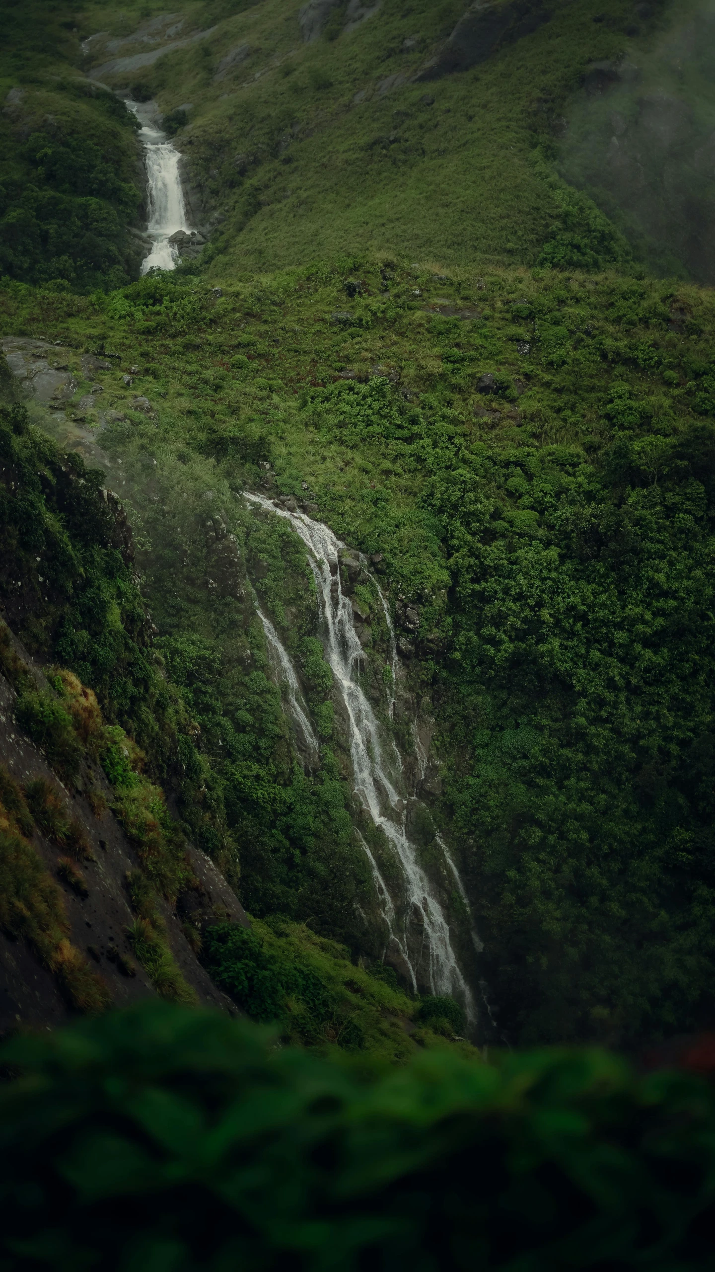 a waterfall in the middle of a lush green valley, by Daniel Lieske, pexels contest winner, hurufiyya, tall thin, te pae, thumbnail, 268435456k film