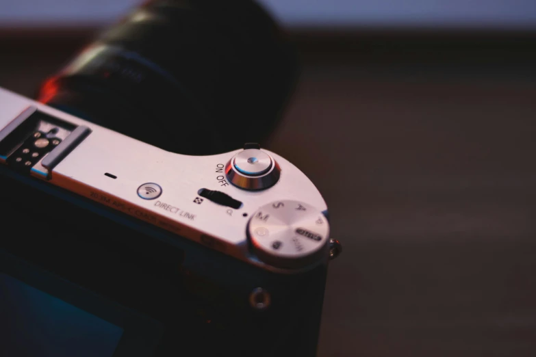 a close up of a camera on a table, unsplash, sony a7z, macro up view metallic, sony a7, dof wide