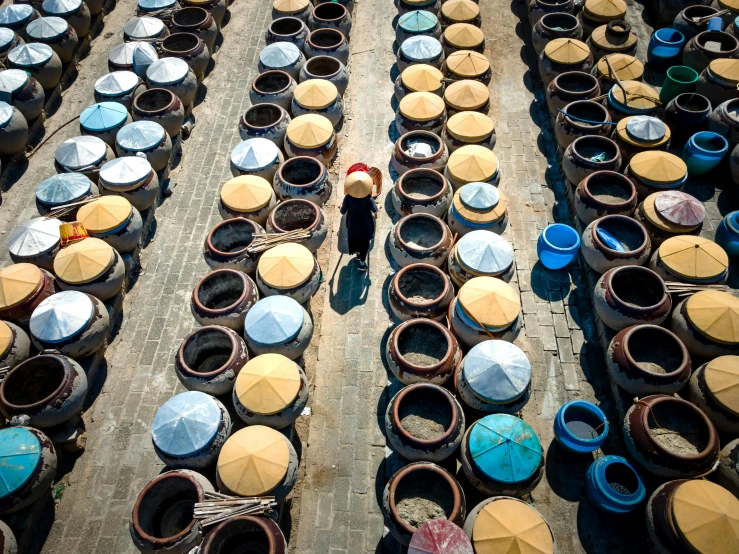 a lot of pots that have umbrellas on them, inspired by Steve McCurry, unsplash contest winner, fish market stalls, avatar image, ao dai, pov photo