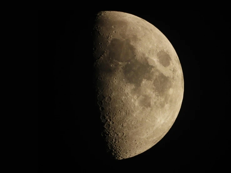 the moon is lit up in the dark sky, taken on a 2010s camera, telescope, half and half, moonscape