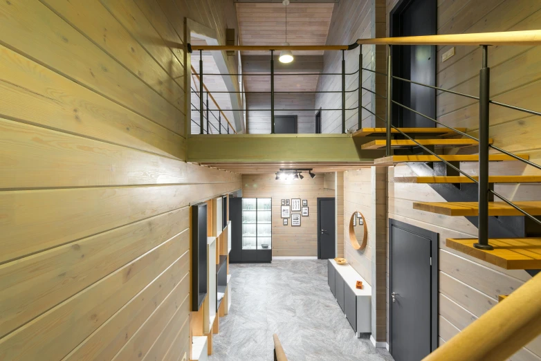 a staircase leading to a second floor of a building, wood panel walls, astri lohne, houzz, thumbnail