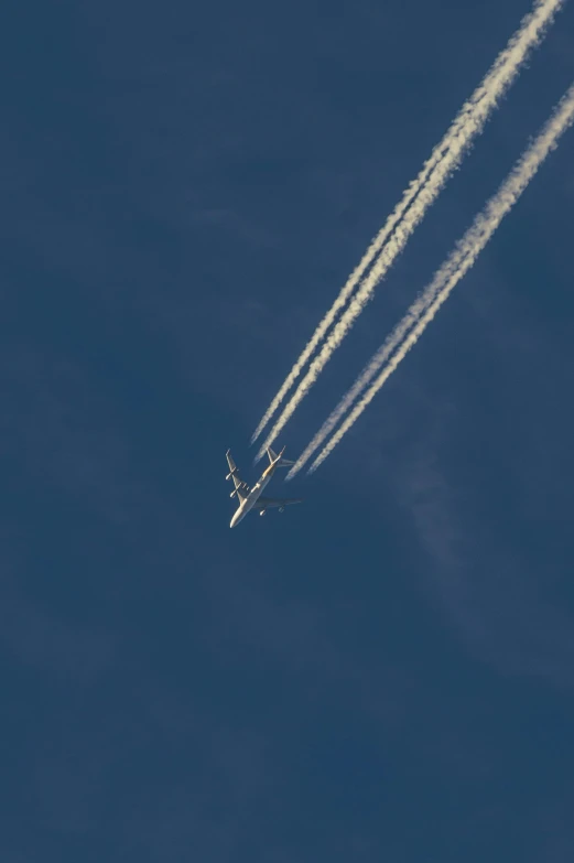 a couple of airplanes flying through a blue sky, by Paul Bird, nasa space photography, kiss, f / 1, full frame image