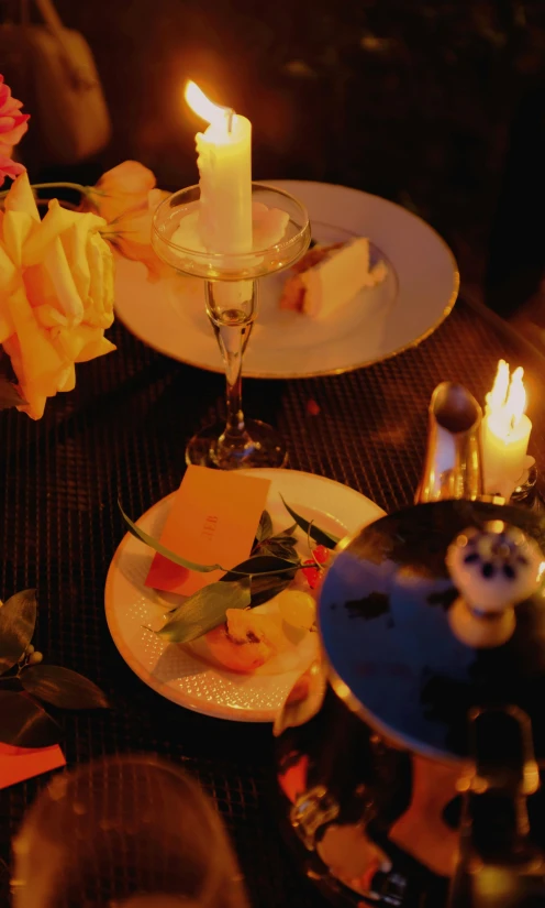 a table topped with plates of food and candles, renaissance, digital image, close - shot, nightclub, photos