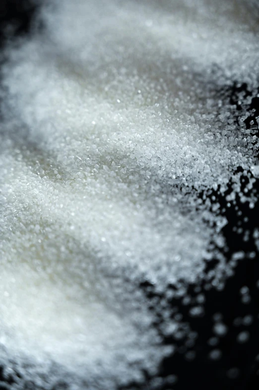 a pile of sugar sitting on top of a black surface, a microscopic photo, trending on pexels, closeup of arms, ilustration, soft organic abstraction, drugs