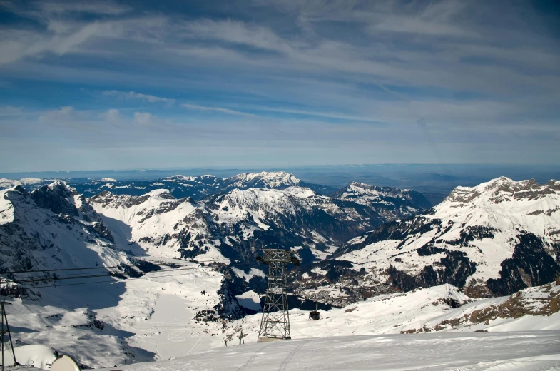 a group of people riding skis on top of a snow covered slope, by Sebastian Spreng, pexels contest winner, overlooking a valley, geiger, chairlifts, avatar image