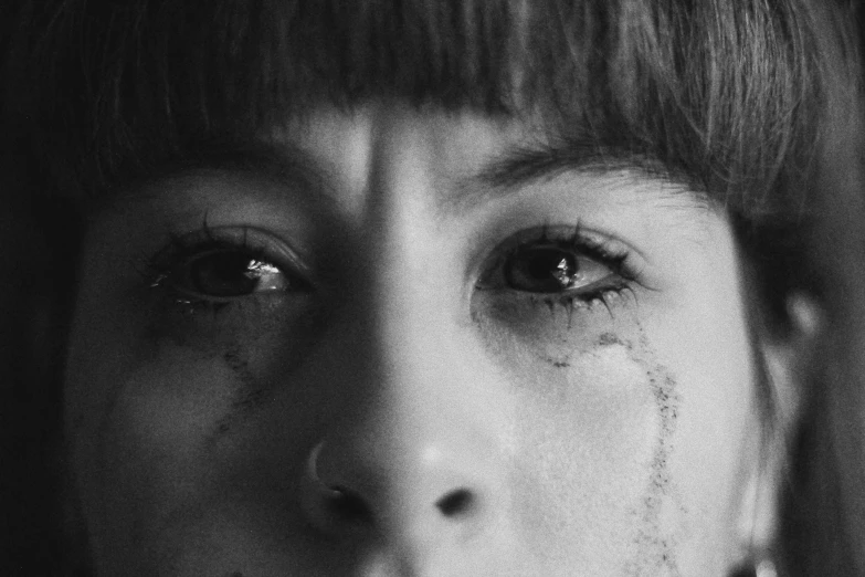 a black and white photo of a woman with tears on her face, pexels, hyperrealism, melanie martinez, close up of lain iwakura, black eyed kids, netflix